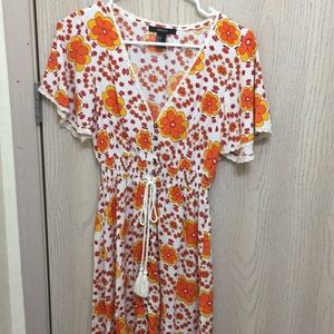 Sundress! Very cute with a little 80’s style!